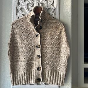 Sleeveless cardigan.